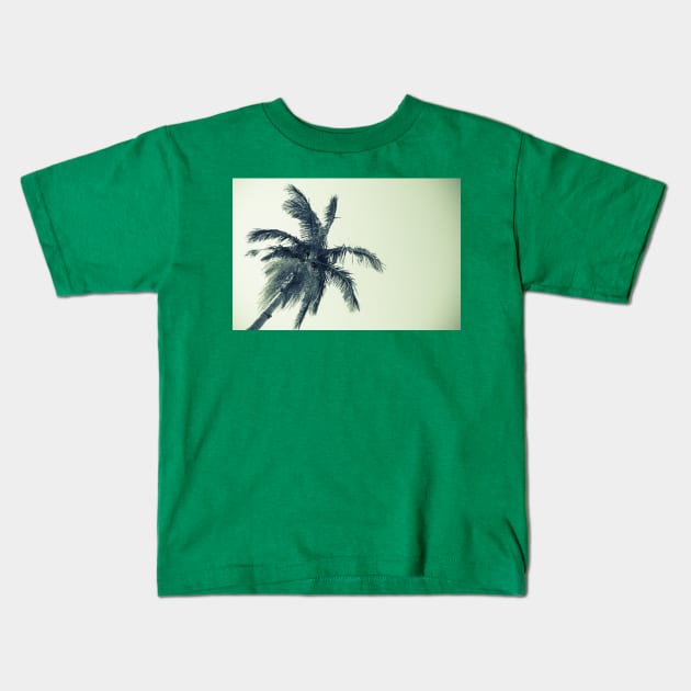 Palm tree against sky low angle point of view monochrome faded image. Kids T-Shirt by brians101